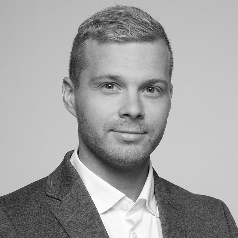 Professional black and white headshot of a man.